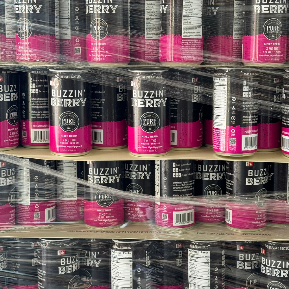 Retail shelves stacked with Buzzin Berry THC seltzer cans
