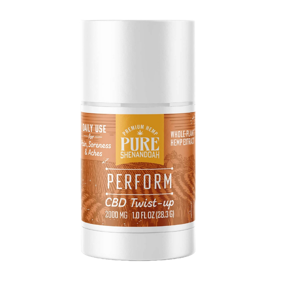 Pure Shenandoah Perform CBD Twist-up in white container with orange wood-grain label, 2000 mg CBD, 1 oz (28.3 g) stick format.