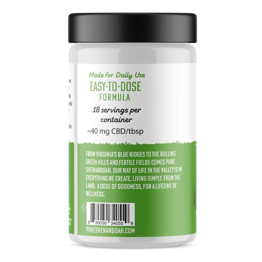 Side view of Pure Shenandoah Infuse CBD Coconut Oil 10 fl oz jar with 750 mg CBD, showing dosing instructions, barcode, and green label details.
