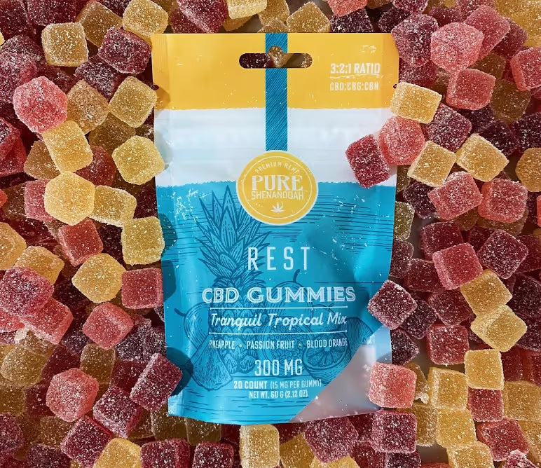Bag of Rest CBD and THC gummies from Pure Shenandoah laying on a spread of gummies, crafted in Virginia for relaxation.