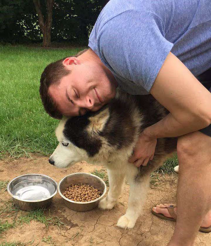 Pure Shenandoah founder Tanner Johnson holding his dog Zeus, the inspiration behind the company’s pet CBD oil line.